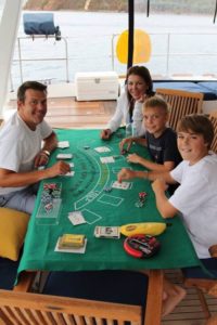 Guests play Blackjack during a rainy afternoon aboard Catsy