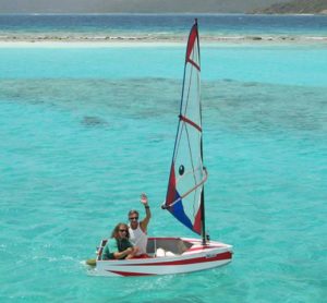 Families enjoy sailing a dinghy aboard charter yacht Milagro